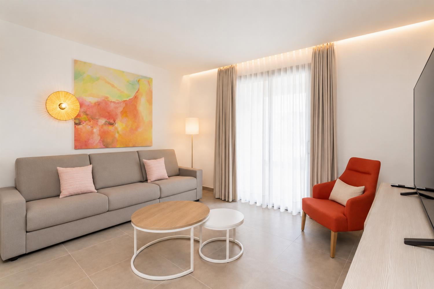 A bright modern living room with elegant neutral decor.