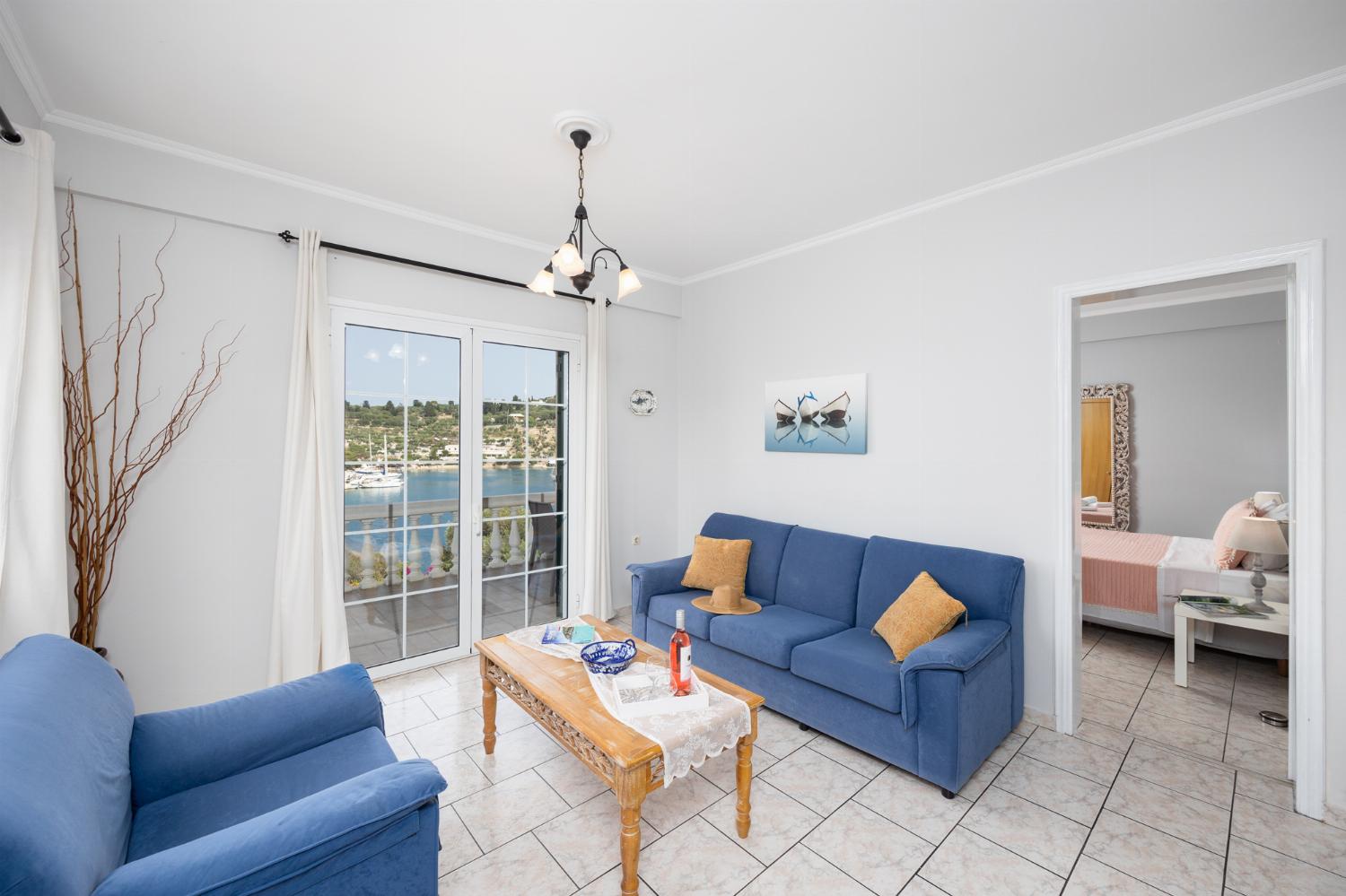 First floor: open-plan living room with sofa, dining area, kitchen, WiFi internet, satellite TV, and sea views