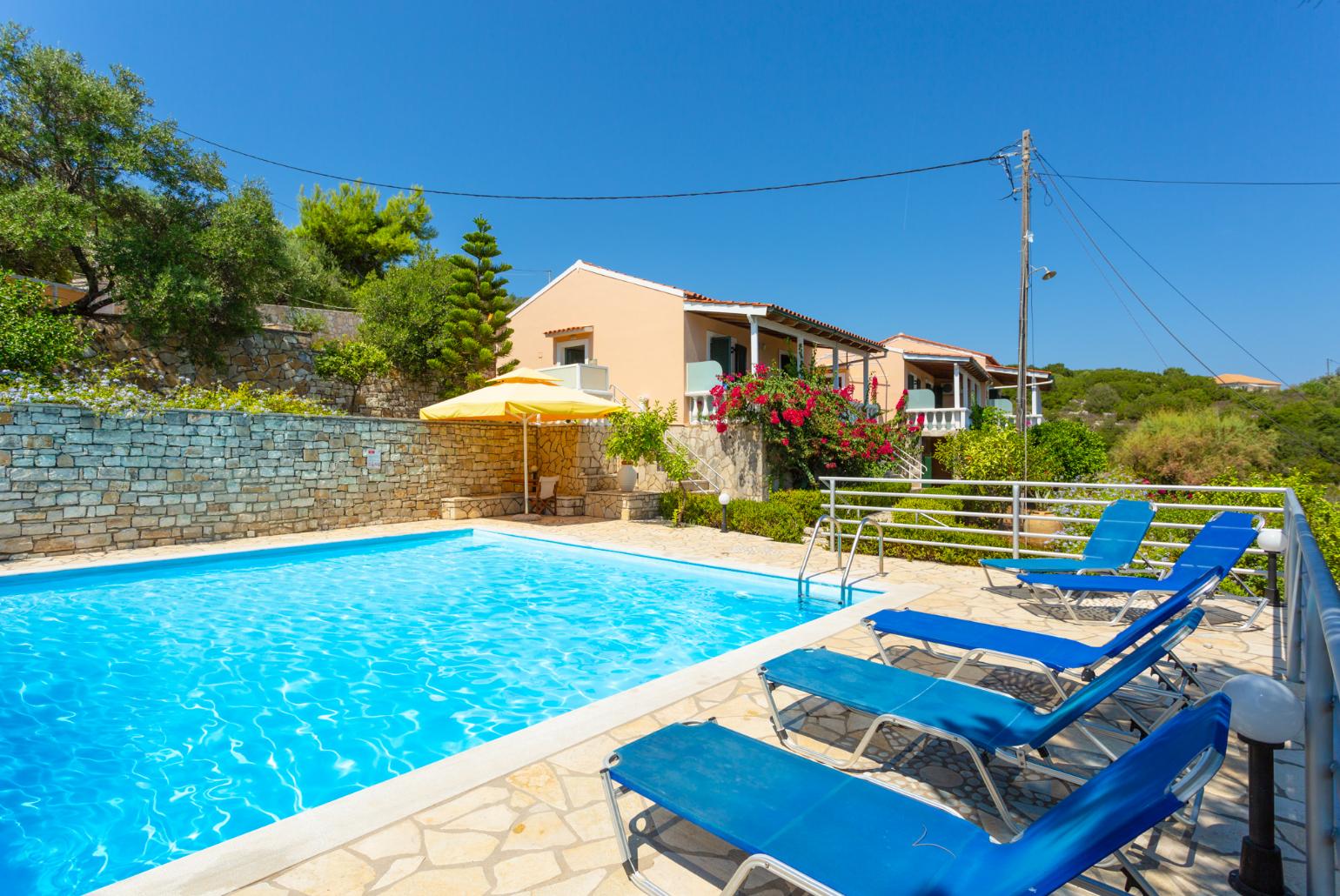 Shared pool and terrace area with sea views