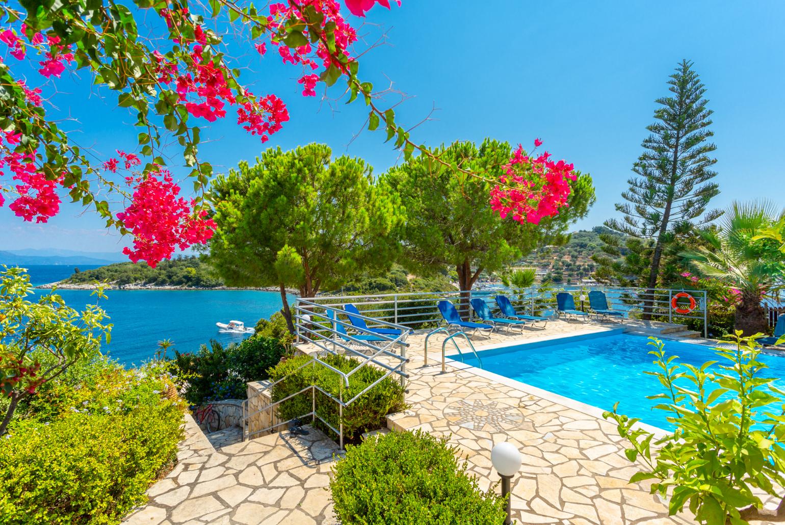 Shared pool and terrace area with sea views