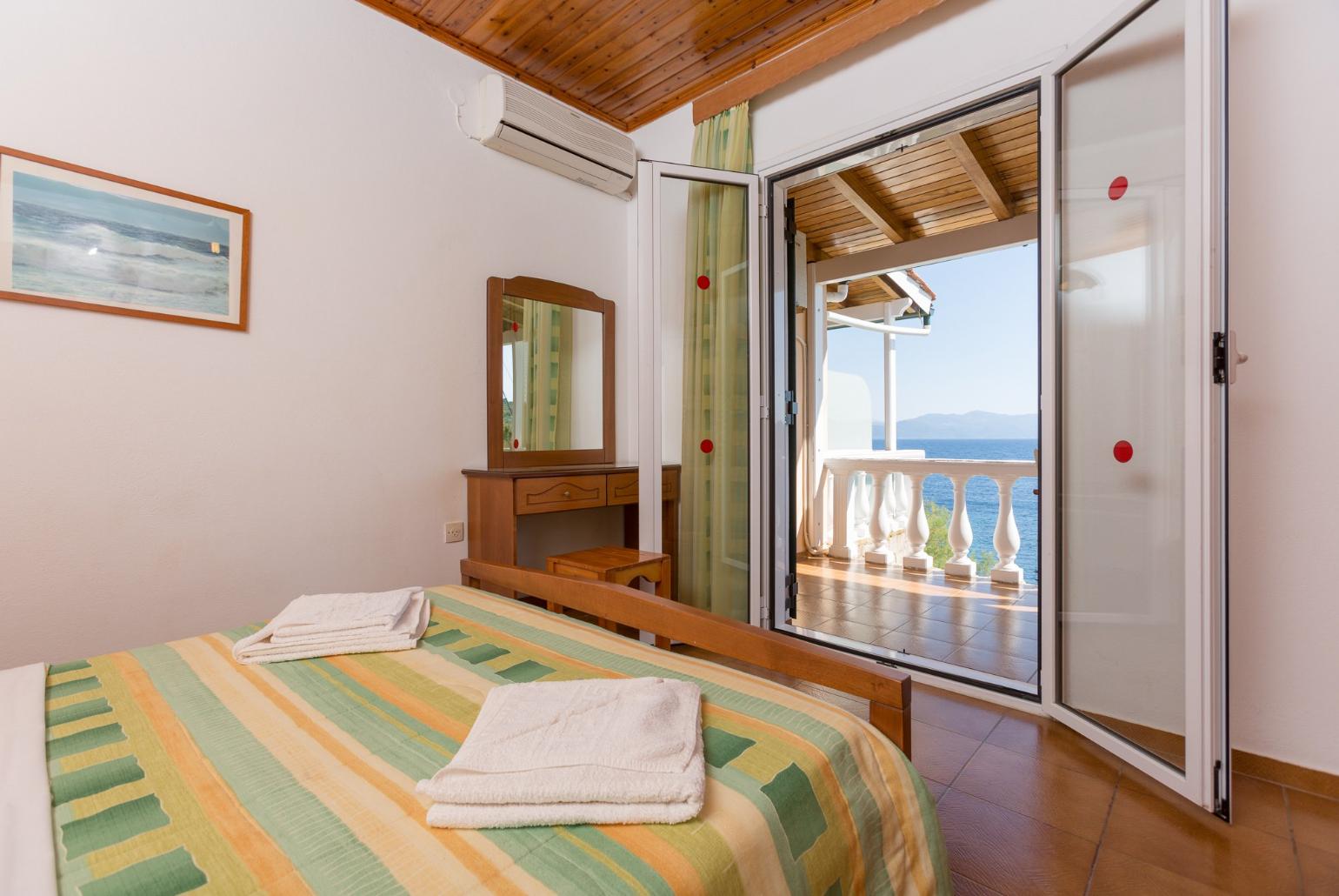 Double bedroom with A/C and balcony access with sea views