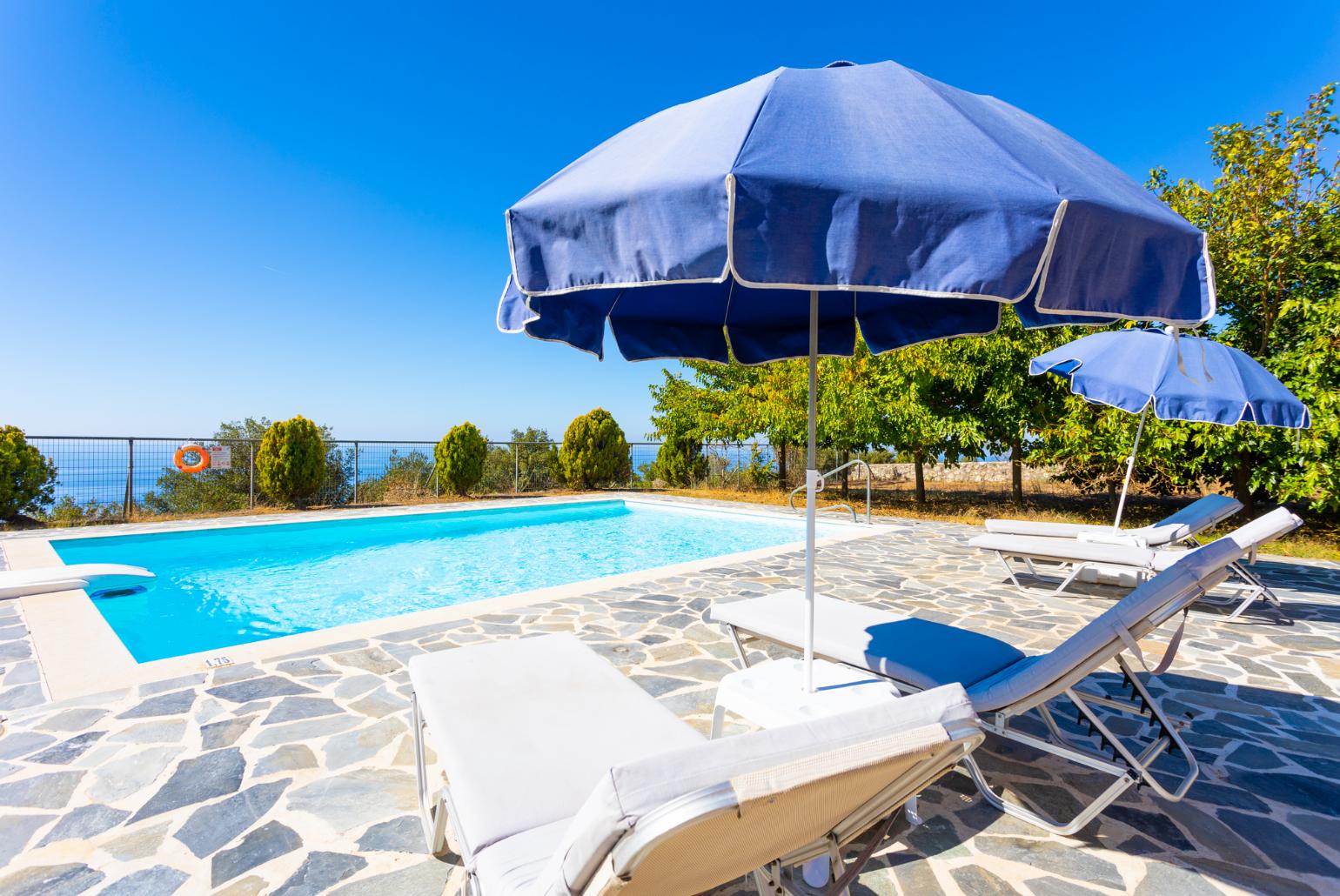 Private pool, terrace, and garden with panoramic sea views