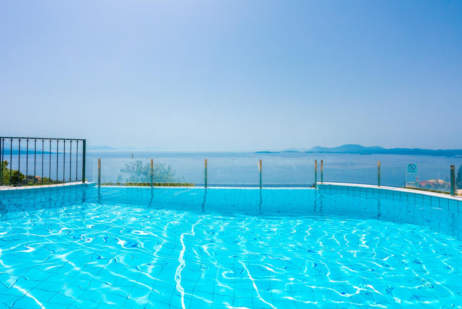 Private infinity pool and terrace with panoramic sea views