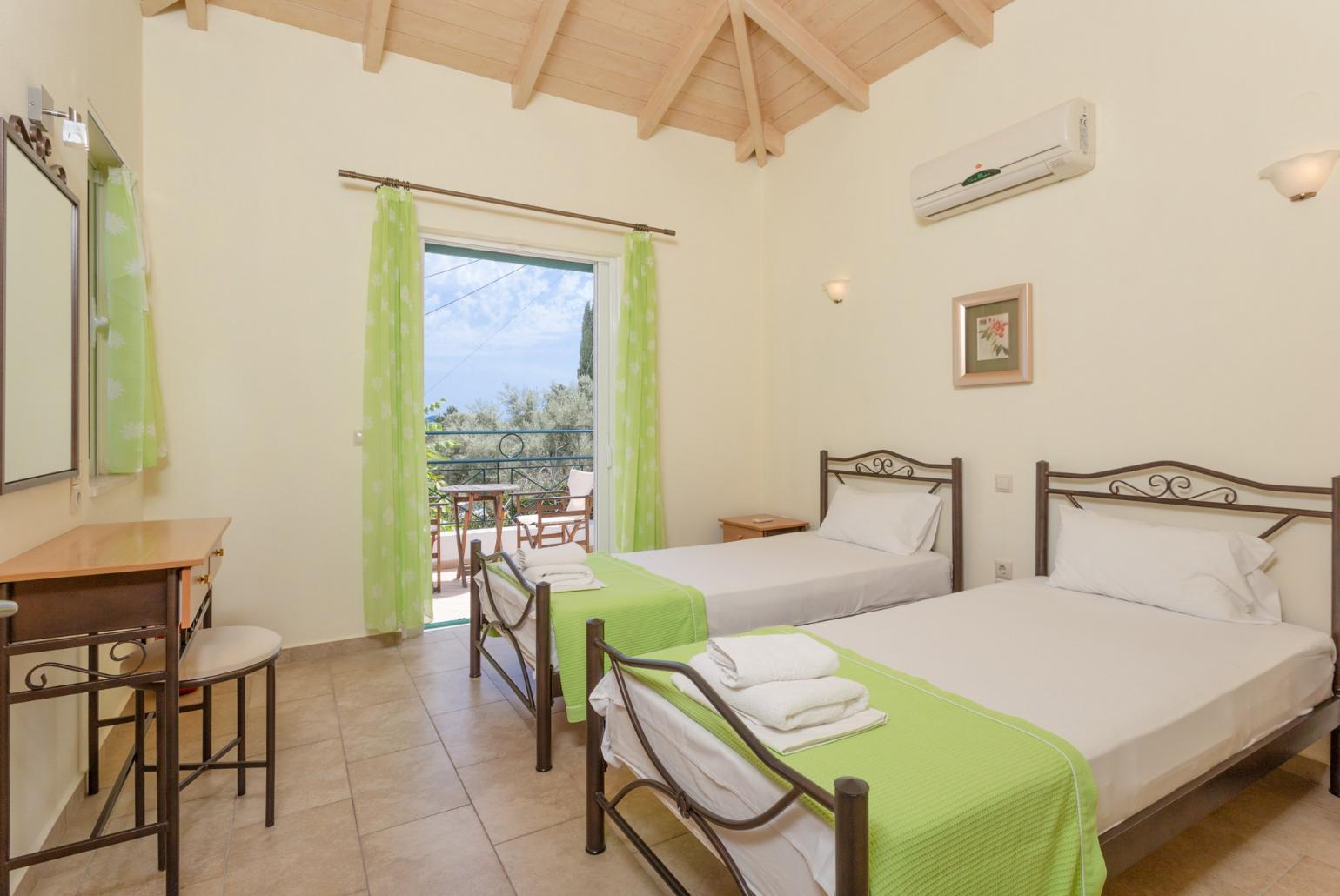Twin bedroom with A/C and balcony with sea views
