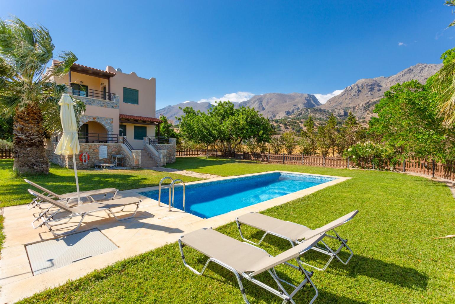 Beautiful villa with private pool, terrace, and lawn with sea views