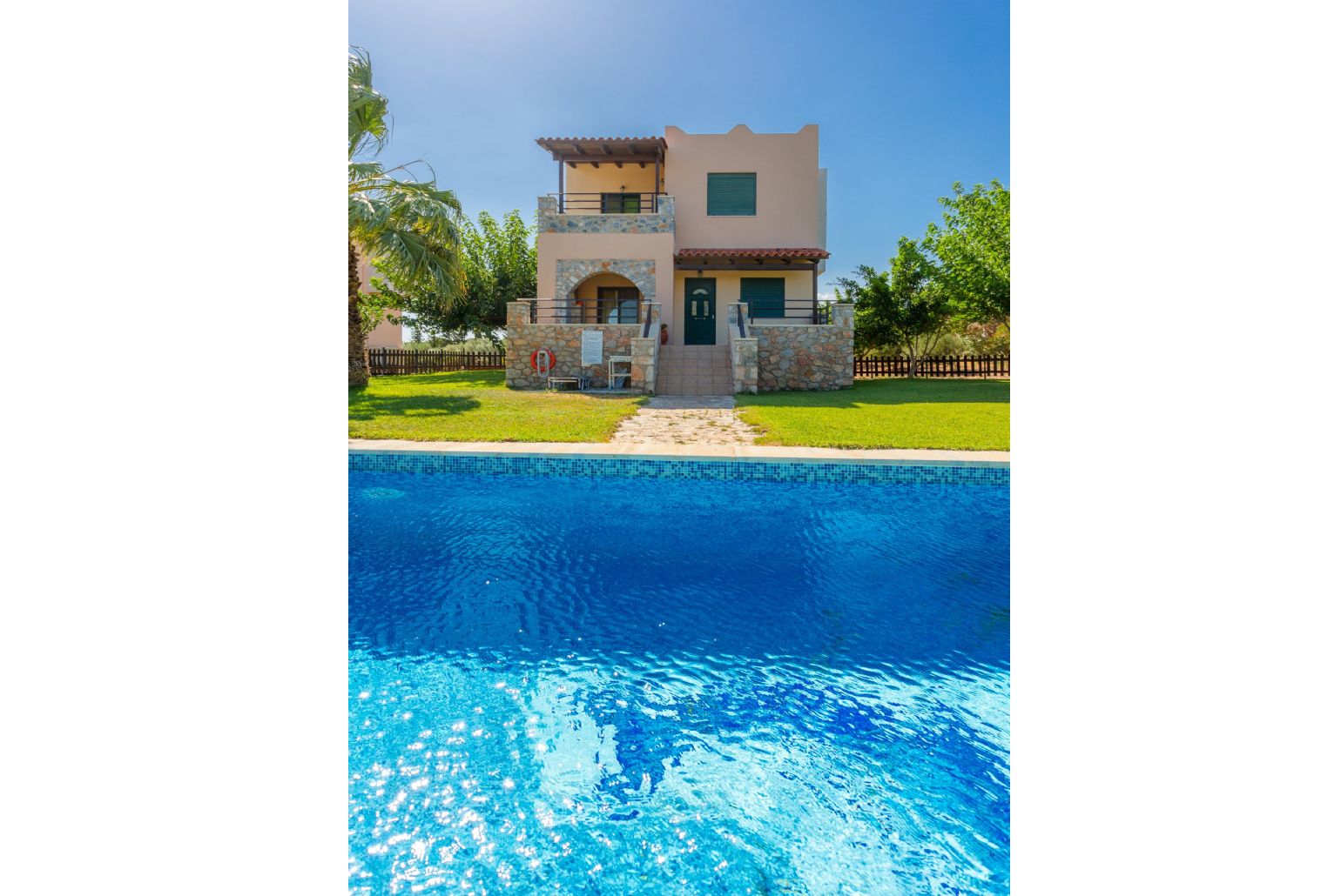 Beautiful villa with private pool, terrace, and lawn with sea views
