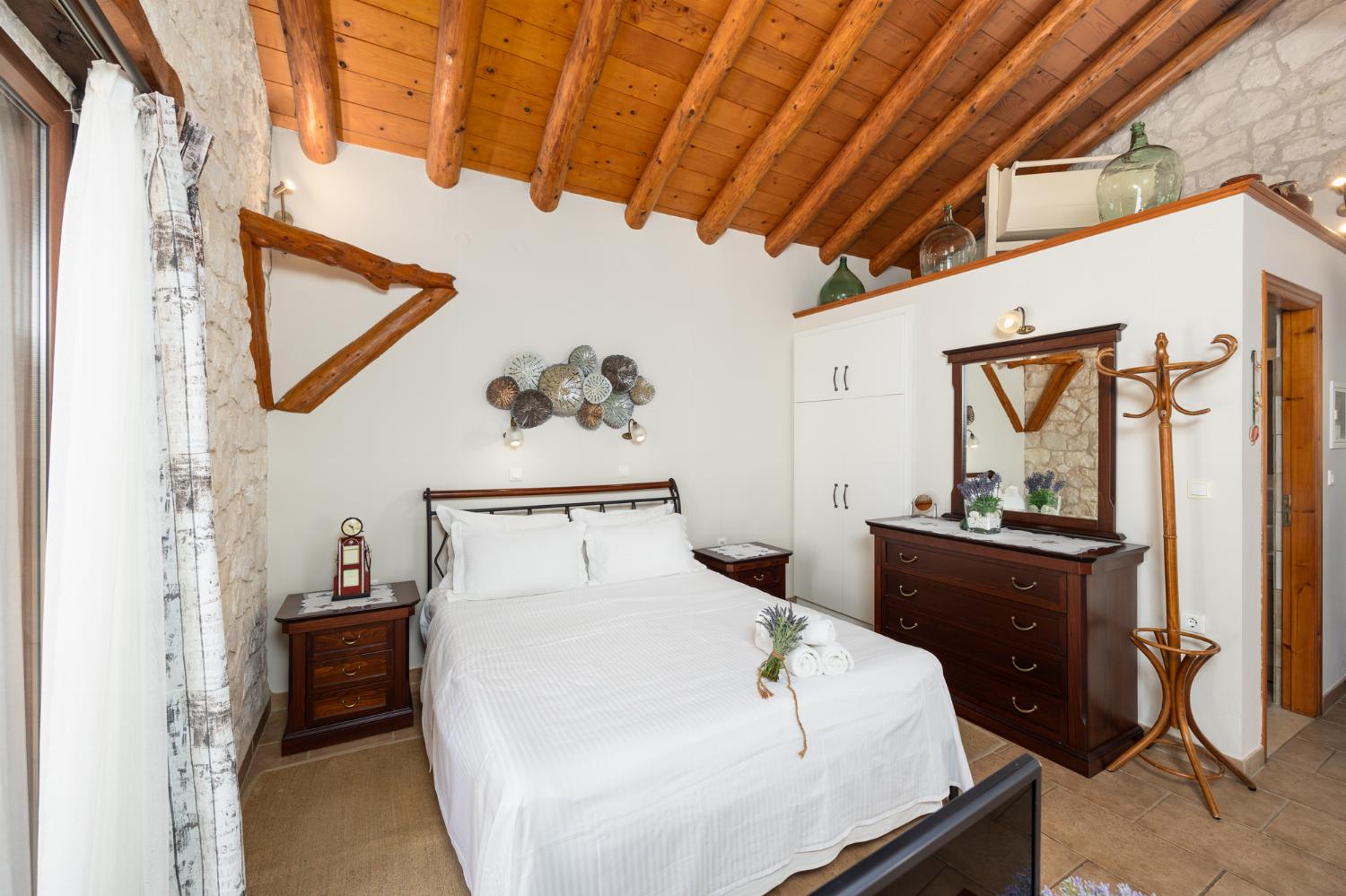Open-plan villa with sofa, dining area, kitchen, double bed, bathroom, ornamental fireplace, A/C, WiFi internet, satellite TV, and sea views